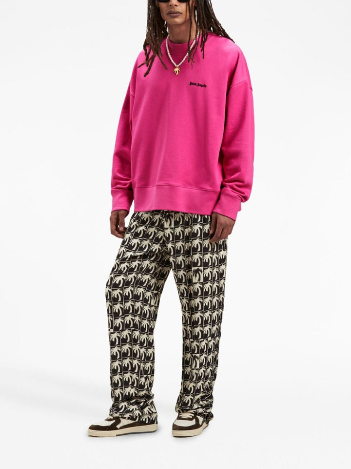 Palm Angels Pantalon ample à imprimé palmier - Lothaire