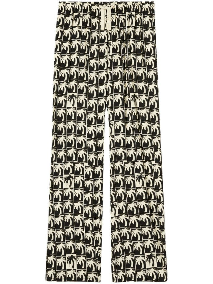Palm Angels Pantalon ample à imprimé palmier - Lothaire