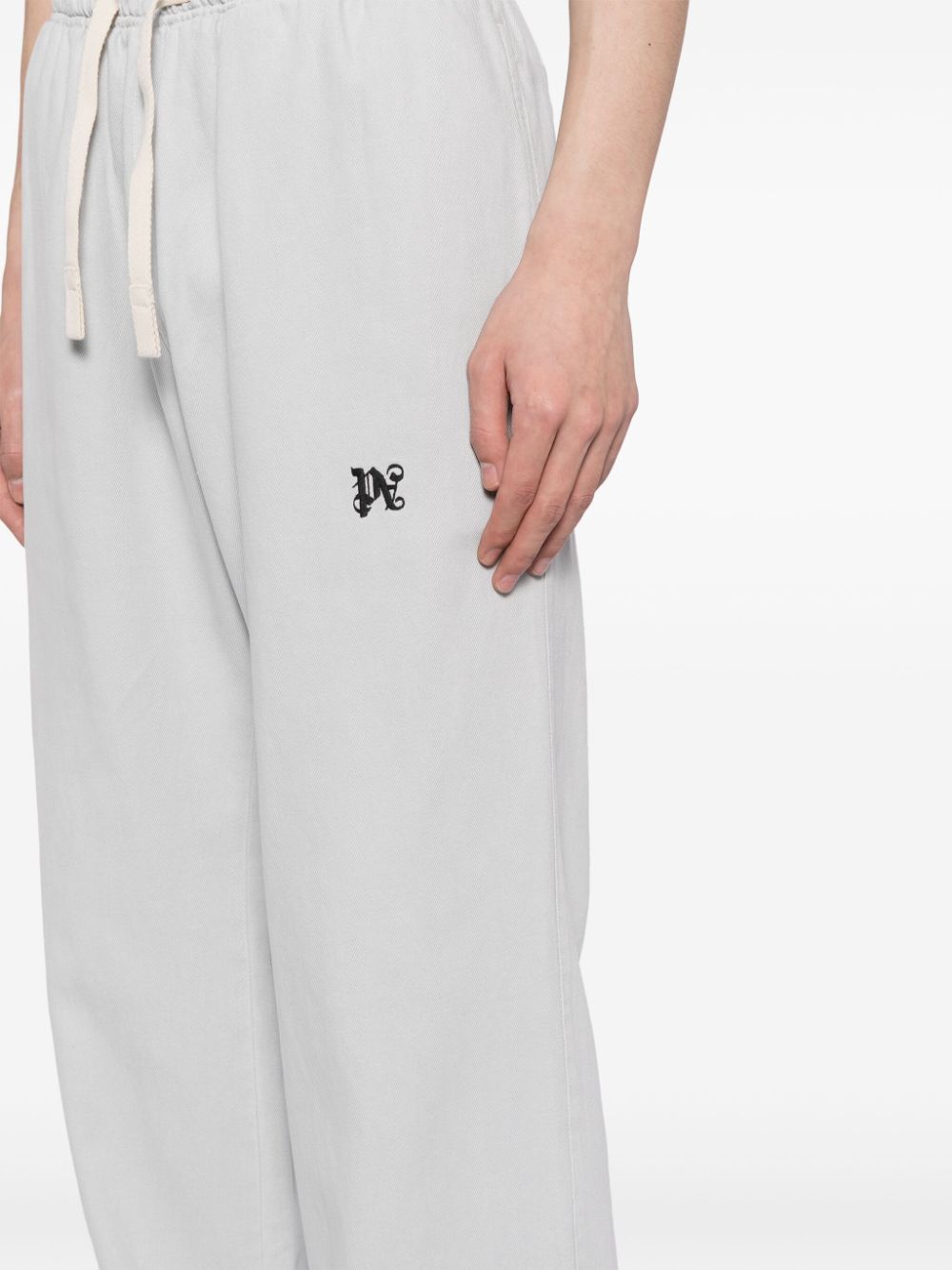 Palm Angels Pantalon gris Monogramme - Lothaire