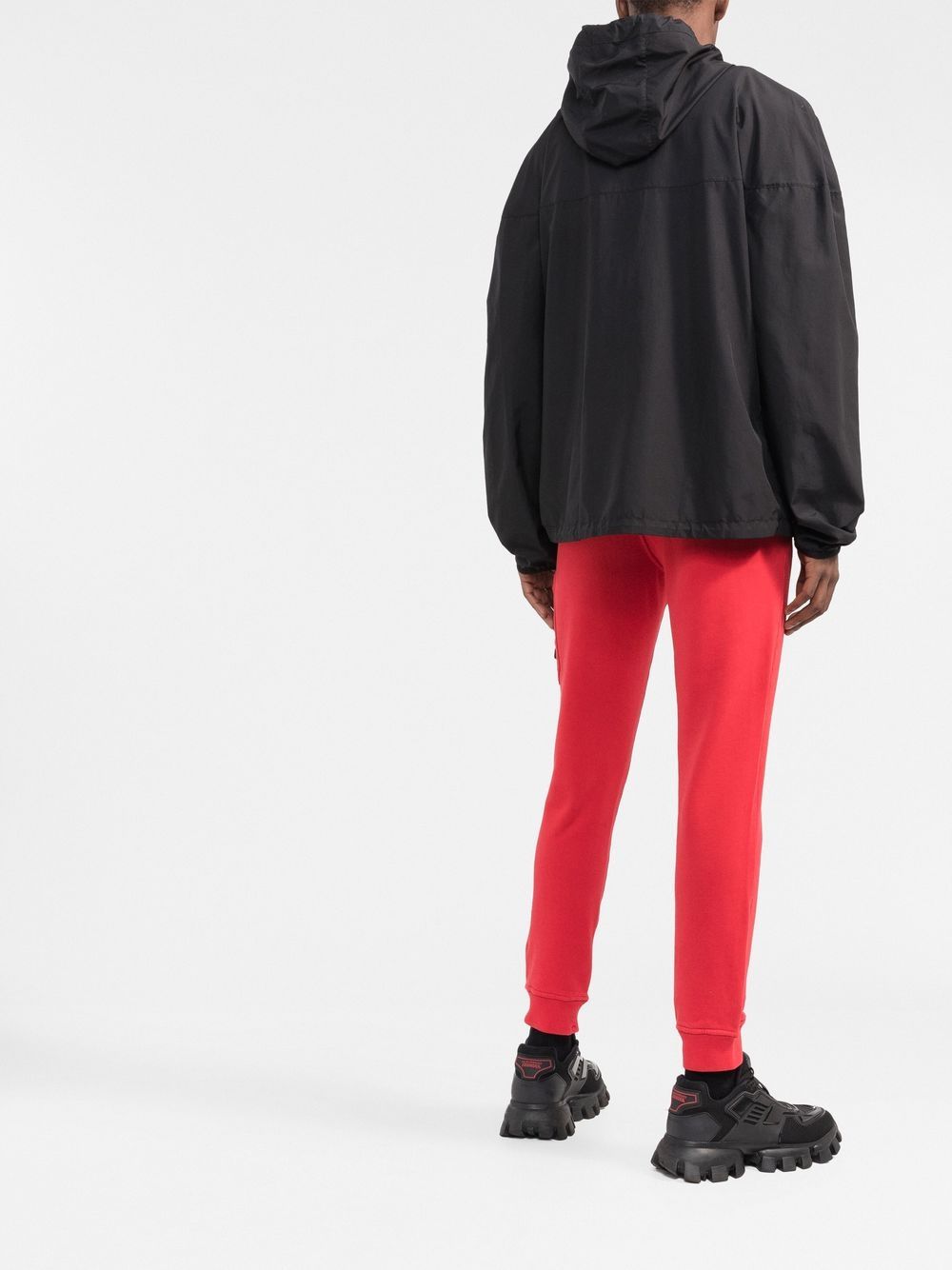 Stone Island Pantalon de jogging rouge fuselé à patch compass - Lothaire boutiques