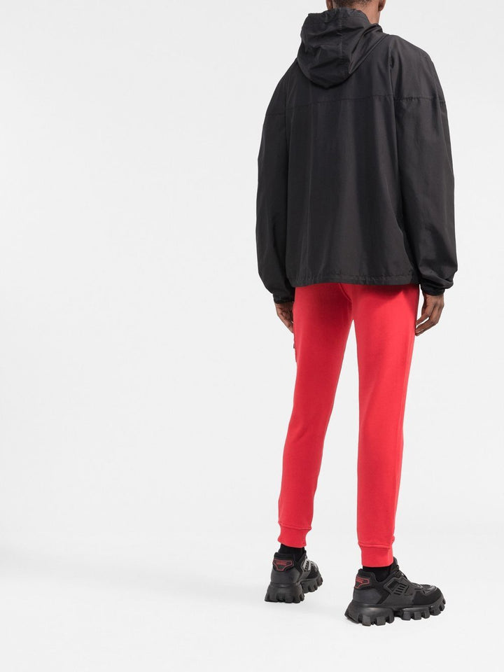 Stone Island Pantalon de jogging rouge fuselé à patch compass - Lothaire boutiques